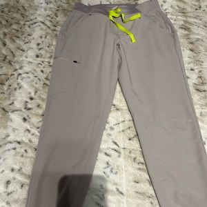 Woman’s light gray fig scrubs